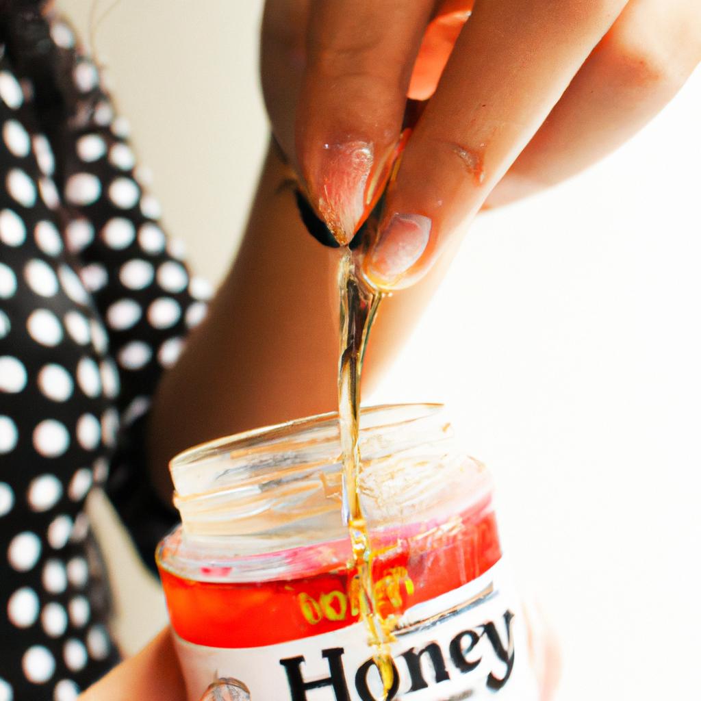 Person applying honey-infused hair product