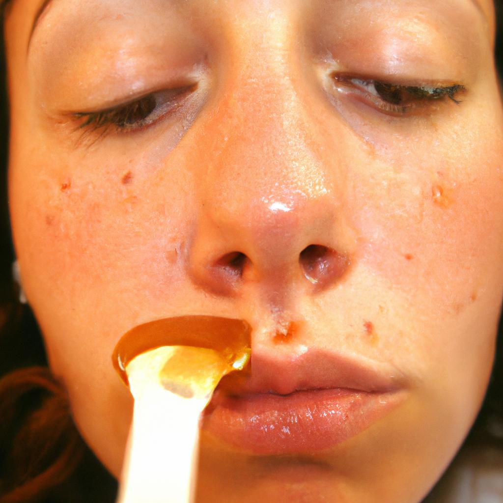 Person applying honey on face