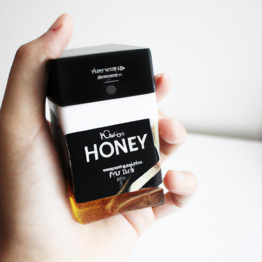 Person holding honey-infused hair product