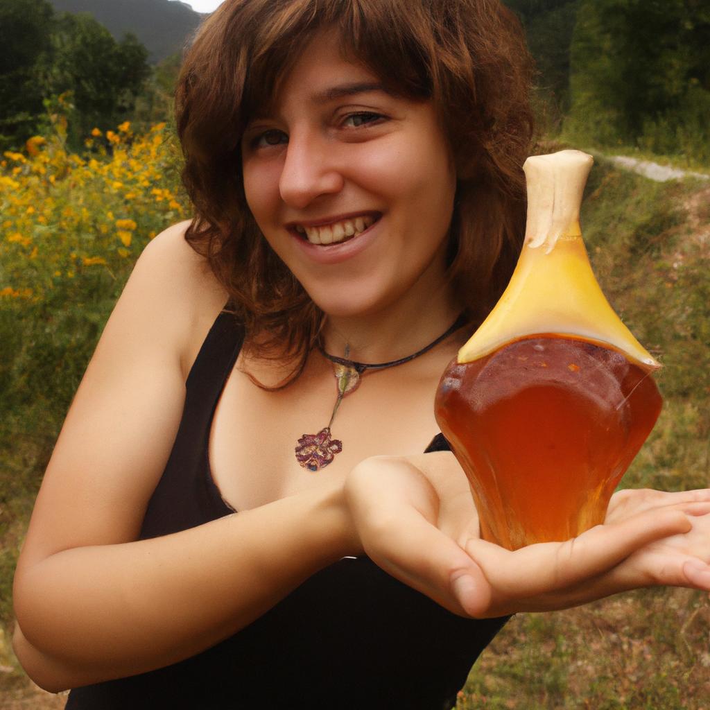 Person holding honey jar, smiling
